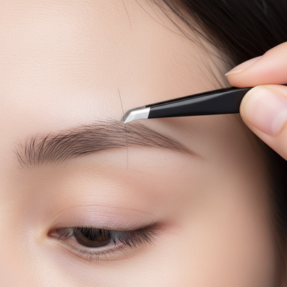Hands using Crown Stainless Steel Slanted Tweezer STW-S to precisely shape eyebrows with slanted tip