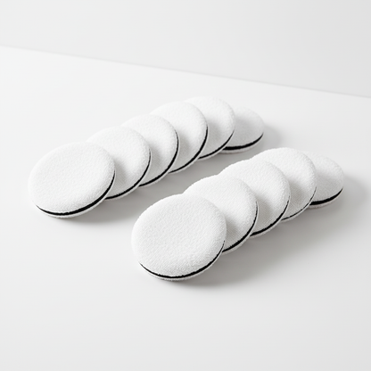 Crown disposable compact powder puffs arranged on clean surface