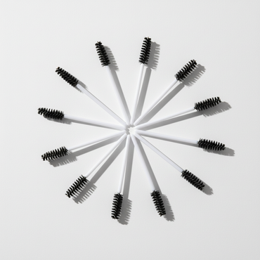 Crown disposable mascara spoolies arranged on clean surface