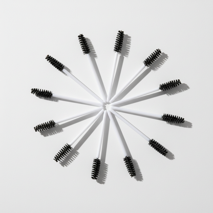 Crown disposable mascara spoolies arranged on clean surface